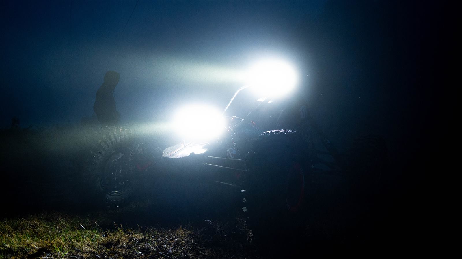 The Hyper Racer D1 at night, light bars cutting through fog